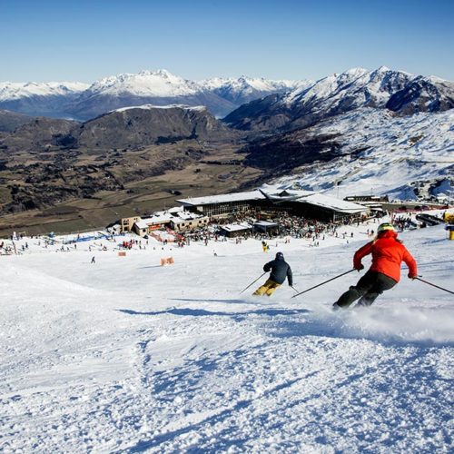 Two Mountain Collective skiers headed to the lodge at Coronet Peak + The Remarkables in NZ.
